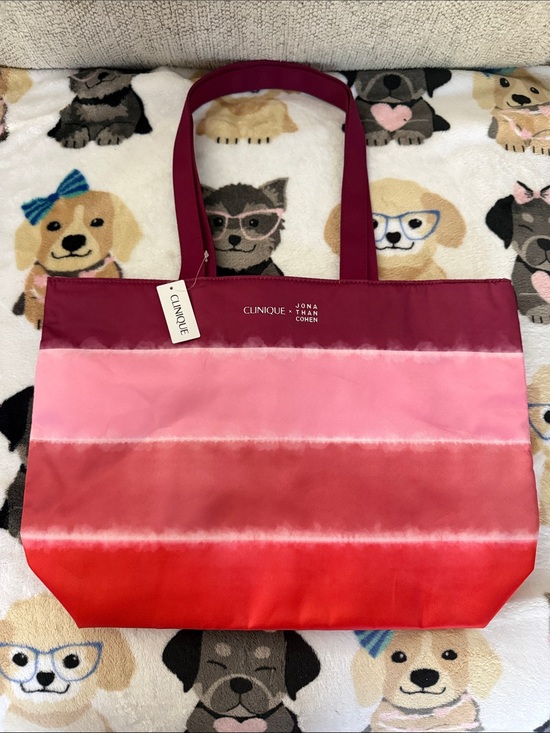 Clinique Handbags - Clinique Ombre Pink to Red Satin Tote